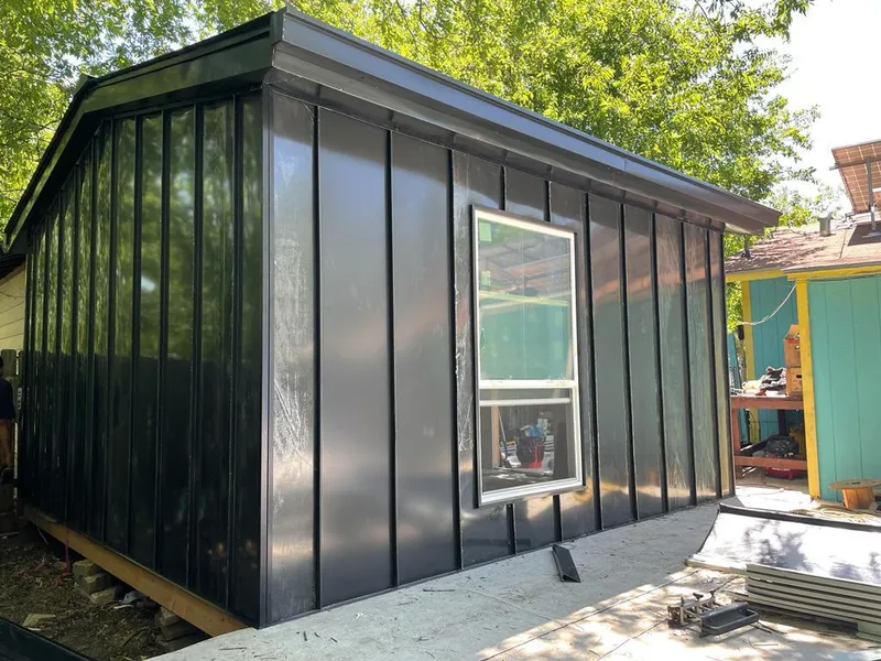 Black standing seam metal wall panels for Roof Inspection in Apex